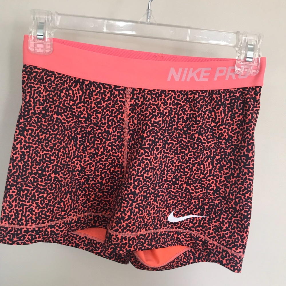 Orange and black nike pro compression shorts